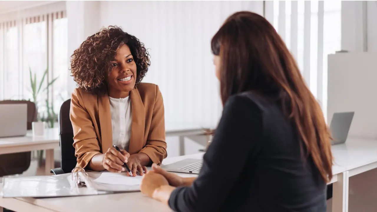 a dentist tries to complete the process for securing financing by speaking to person at a bank