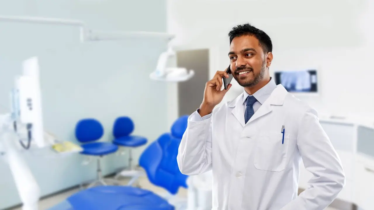 a dentist talks on the phone