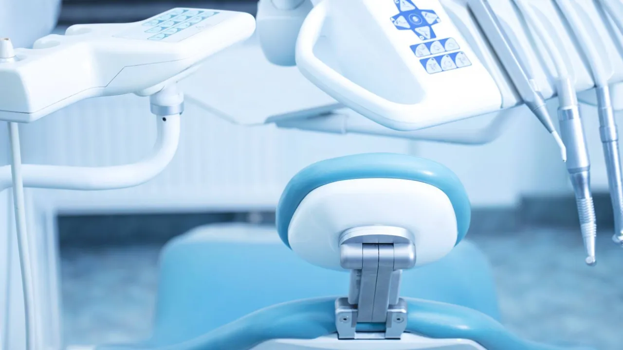 dental equipment sits above a dentist’s chair