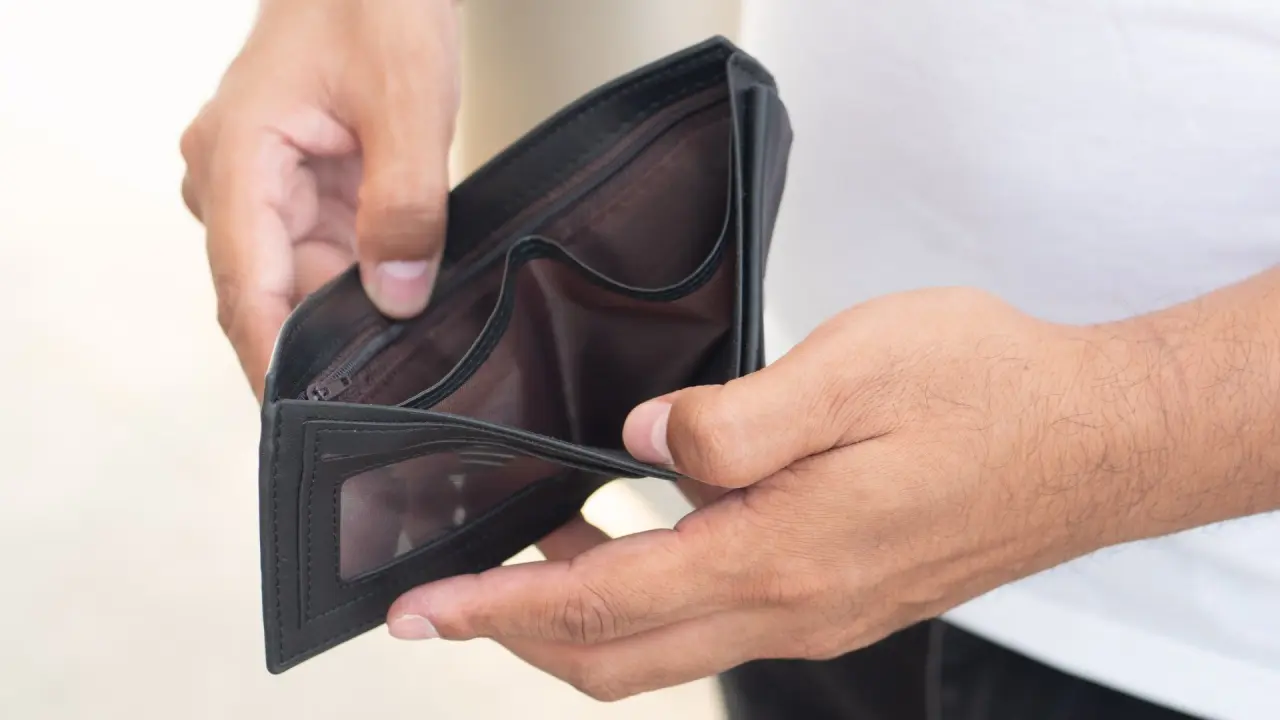 a person opens an empty wallet